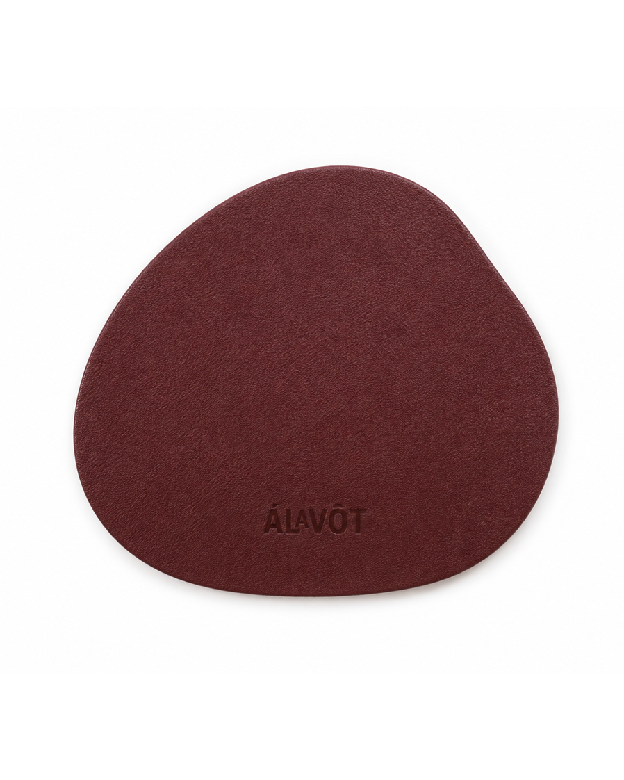Round maroon coaster with 'Alavot' branding on a white background