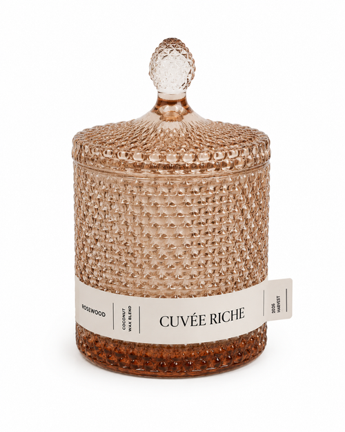 Scented Decorative candle with textured champagne coloured surface and 'Cuvée Riche' label on a white background